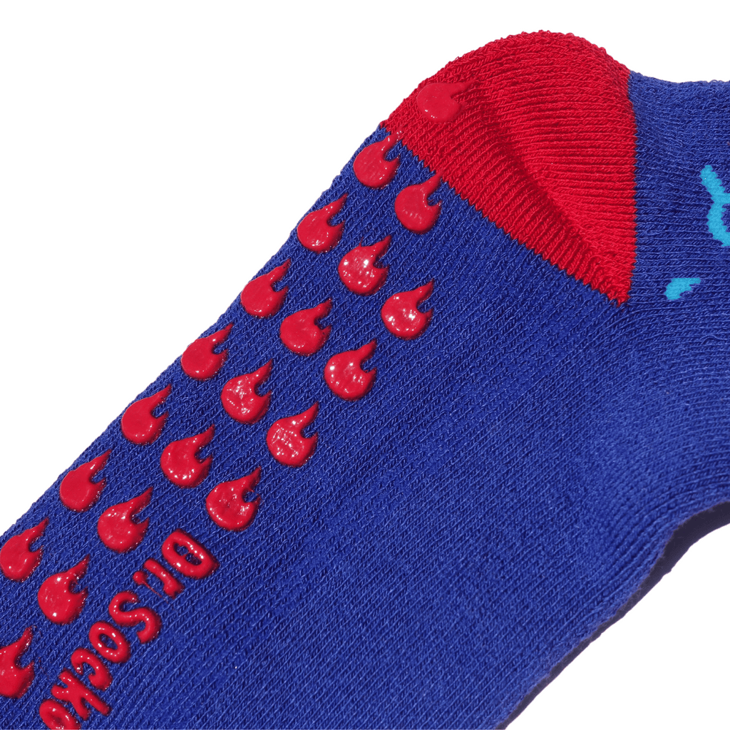 Detailed view of fire red grips on the 'BURNS! Run Under Cool Water' grippy sock.
