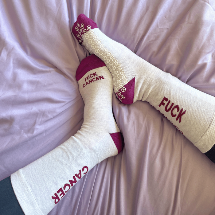 friends holding onto cancer ribbon and providing encouragement