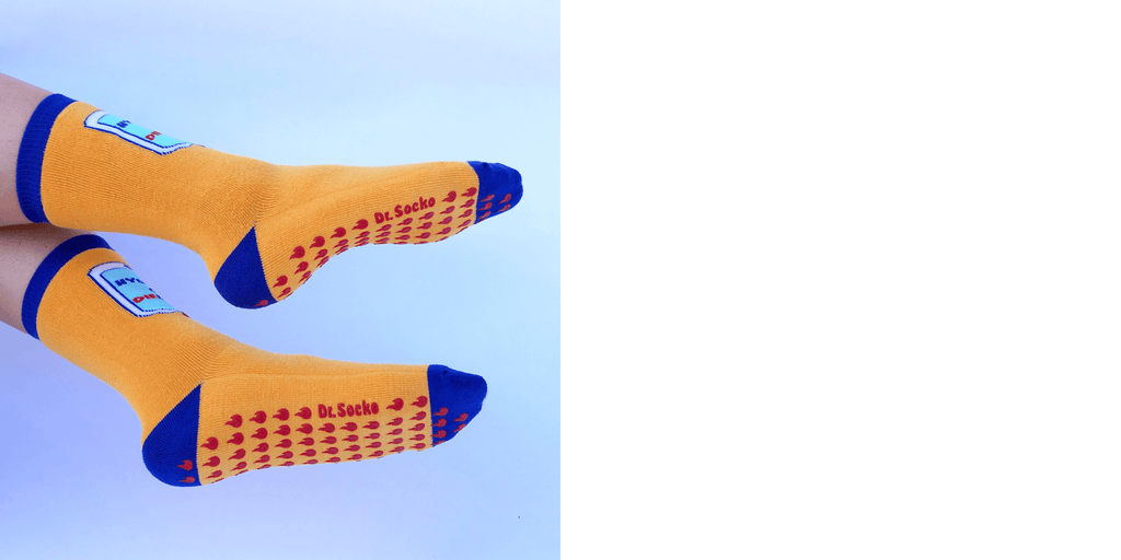 Close-up view of the grip texture on funny grippy sock "hydrate or diedrate", ideal for ensuring safety on slippery surfaces