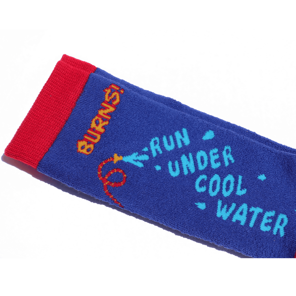 Close-up of 'BURNS!' text on funny hospital sock.