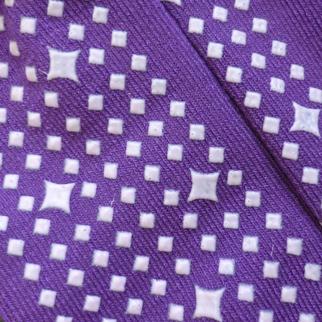 Close-up of diamond lavender grips on the 'F*cking fabulous' hospital sock