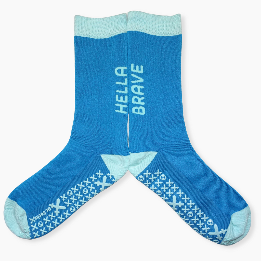 Full display of 'Hella brave' funny grippy sock.