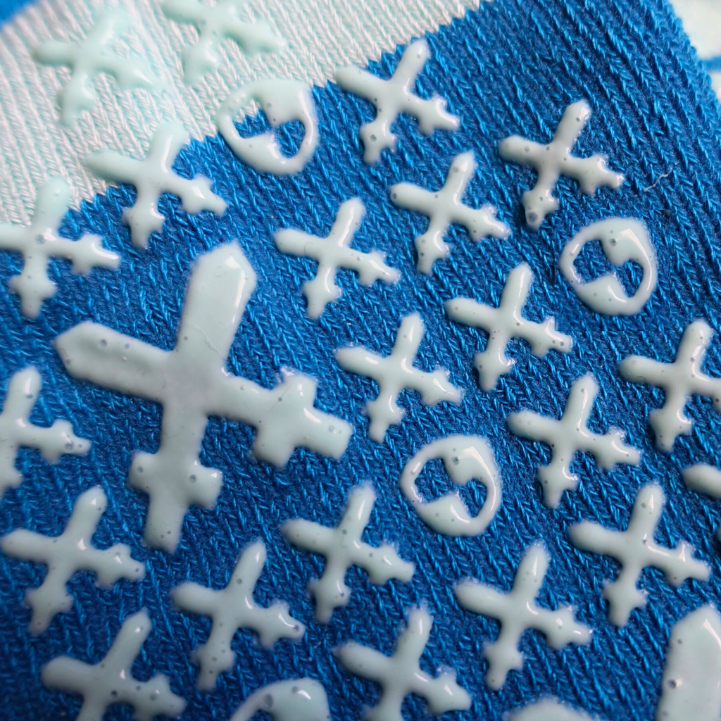Detailed view of swords and shields grips on the 'Hella brave' sock
